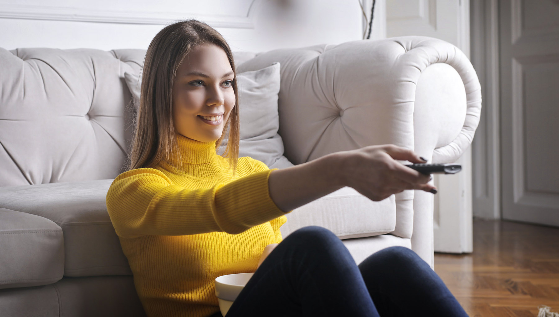 Young Lady watching TV listening to DyHard Productions TV Jingle