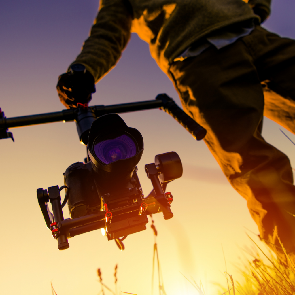 Man holding video camera, cinematic music examples