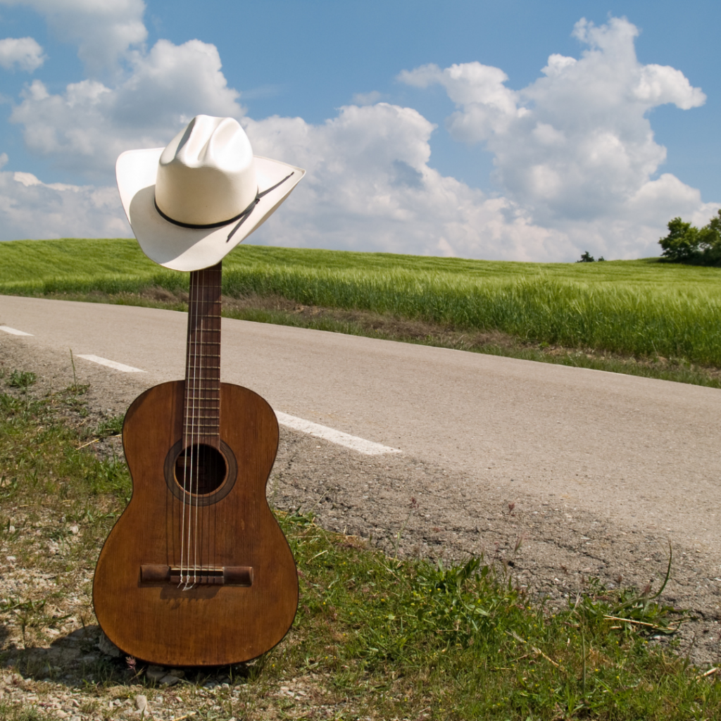 Acoustic guitar cowboy hat country music examples