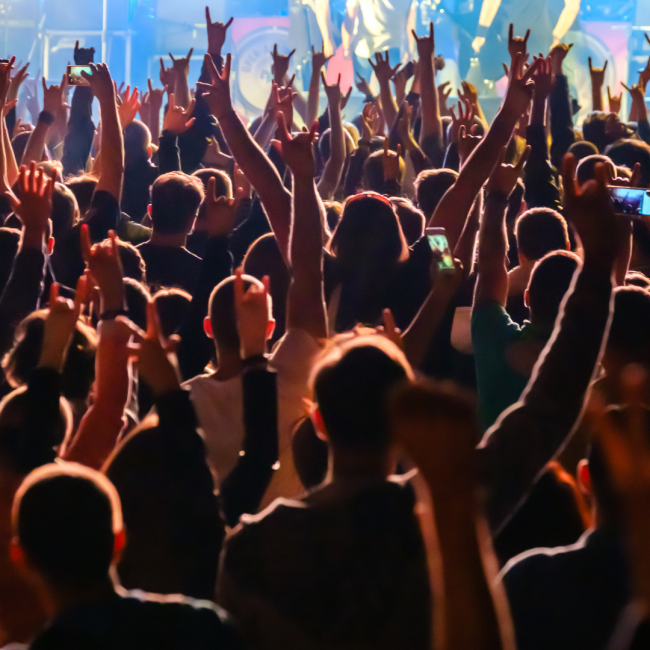 Crowd at rock concert how to tour abroad with your band